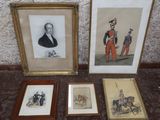 three framed pictures of men in uniforms and hats on a table