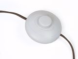 a white light that is connected to a brown cord