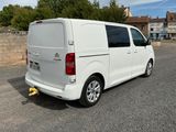 a white van that is parked on the side of the road