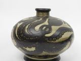 a black and white vase on a white background