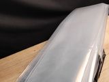 a laptop computer sitting on top of a wooden table