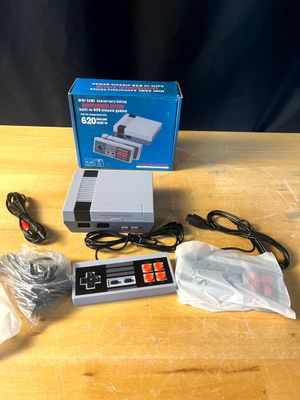 une console Nintendo posée sur une table en bois
