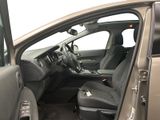 the interior of a car with the door open and the passenger seat down