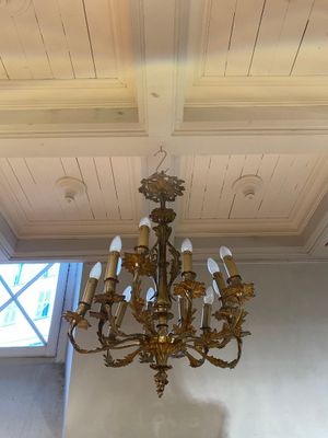 a chandelier hanging from the ceiling in a room