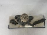 a figurine of a man sitting on top of a table