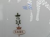 a plate with a crown on it on a table