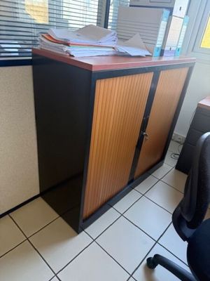 an image of a cubicle with a desk and a chair