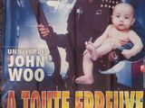 movie poster of a toute epreuve with a baby holding a gun