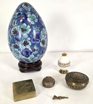 a blue and white vase and other items on a table