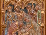 an image of a wooden panel with a painting of a group of people