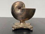 an image of a metal object sitting on top of a table