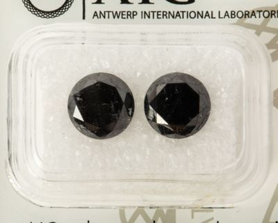 two black diamond stones in a package on a white background