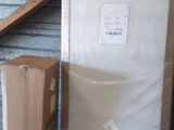 a refrigerator and a refrigerator freezer in a storage room