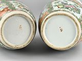 pair of chinese vases with flowers and birds painted on them