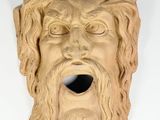 a sculpture of a man with a beard and a crown of thorns on his head