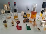 many different types of perfume bottles on the table