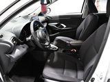 the interior of a car with a steering wheel and black seats