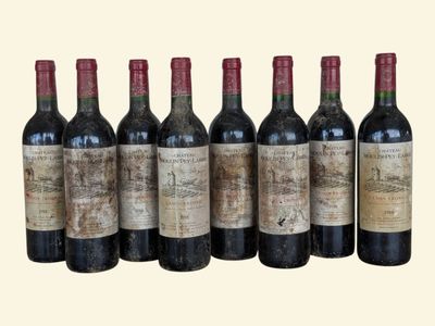 six bottles of wine are lined up in a row