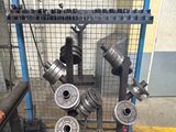 a picture of a machine that is working on a piece of metal