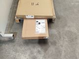 a box sitting on the floor next to a box on a carton