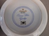 a white plate with a blue and yellow design on it