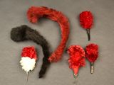 a lot of red and white feathers on a gray surface