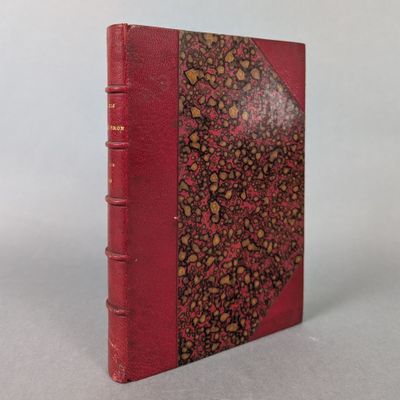 a red book with a floral design on the cover