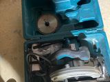 a blue tool box with tools in it on the floor