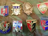 a lot of badges that are on a military uniform