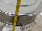 a measuring tape that is on top of a metal pan