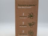 a cardboard box with a picture of a plant inside of it