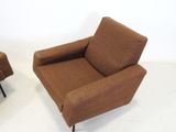 pair of mid - century lounge chairs with upholstered arms and legs