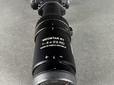 an image of a close up of a camera lens on a table