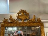 a man taking a picture of himself in a mirror