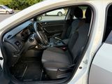 the interior of a car with the door open and the driver ' s seat down