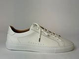 the white sneakers are on a white surface with a white background