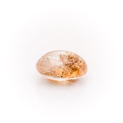 a close up of a yellow and white diamond on a white surface
