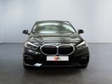 the bmw 6 series sedan is parked in a showroom