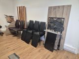 a room with a lot of chairs and a fan in it
