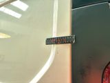 a close up of a stop sign on the side of a car