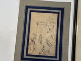 two framed drawings of a man and a woman sitting on a bench