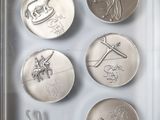 a picture of a picture of a collection of coins in a glass case