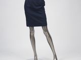 a mannequin wearing a blue dress with a gold belt