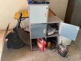 a stack of metal cabinets and tools on the floor