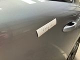 a car with a sticker on the door of it