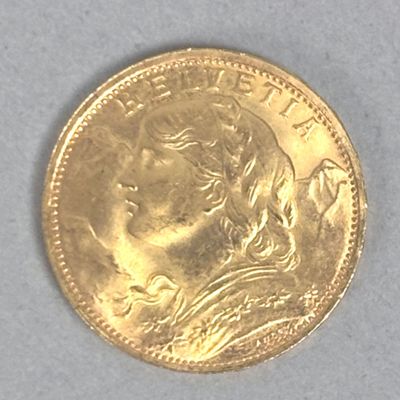 l'image d'une pièce d'or sur laquelle figure le visage d'une femme