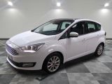 a white ford c - max parked on a checkered floor