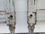 two candles that are sitting next to each other on the floor