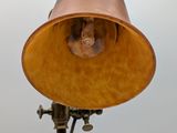 an image of a lamp on a pole with a sky background
