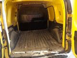 a yellow van that is parked in a parking lot